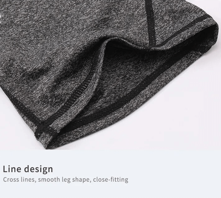 Close-up of grey sports quick dry high-waisted shorts with cross line design for yoga and running.